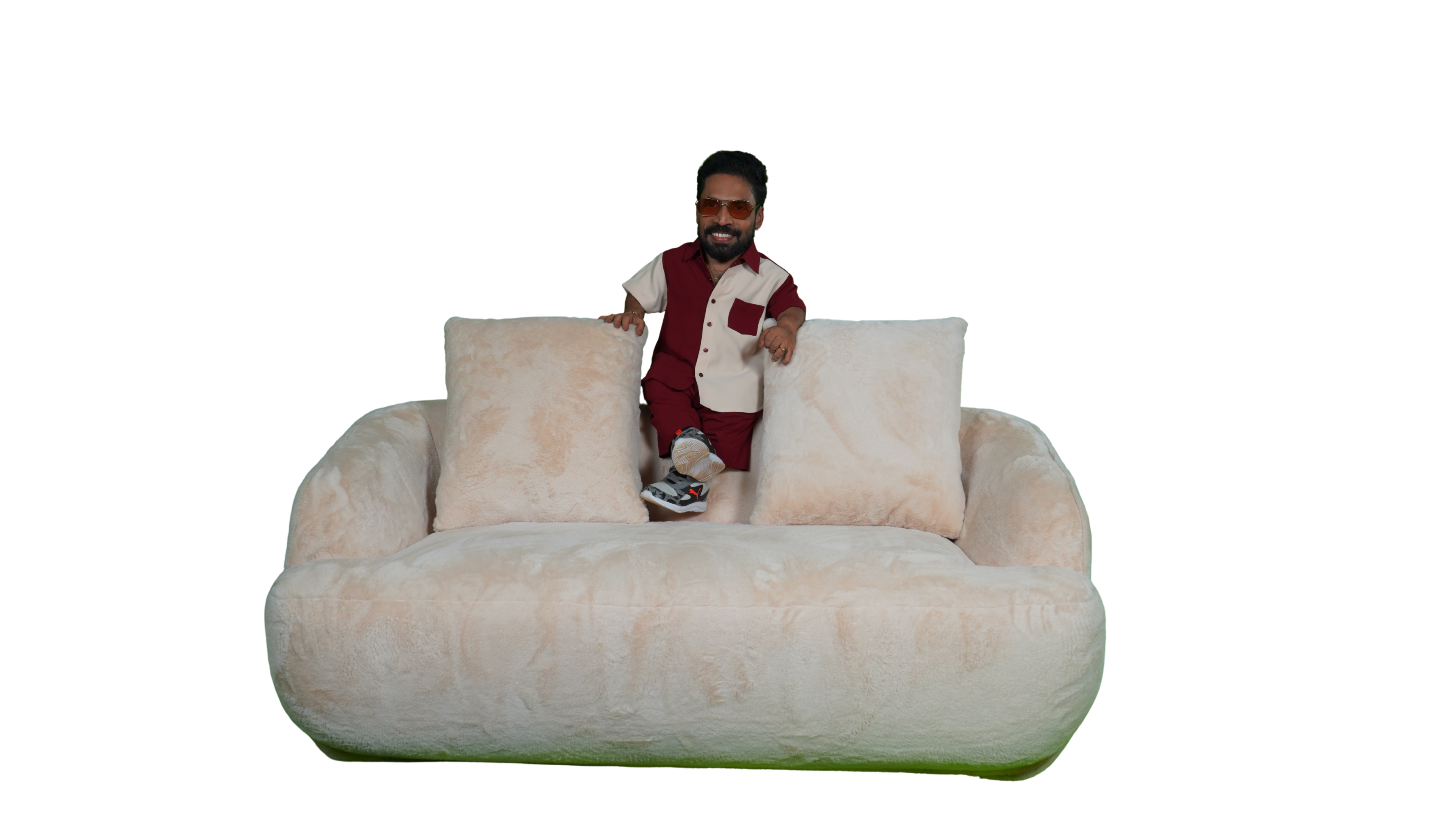 Ajay Kumar lounging on Meubel sofa